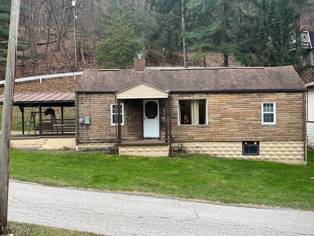 What you have been looking for! This cozy ranch home is in move-in condition. The kitchen is newer, and this house is ready for you! There is a very nice basement with a shower. The furnace is about 10 years old, and the roof is about 15 years old. Per the seller, there is a small trickle of water from a natural spring that runs against the basement wall. It has been that way for 65 years! There is also a sump pump in the basement. Huge concrete-covered patio with a newer metal roof. 20x15 is perfect for outdoor entertaining. The swing stays. There is a nice one-car garage with a manual door and opener. Starting out? Scaling down? Perfect! Public natural spring next door.