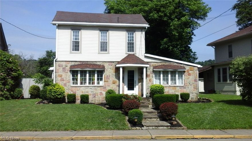 Welcome relaxation with a beautiful view of the Ohio river that can be seen from most rooms in the house.  This Eclectic style 3 bedroom 2 1/2 bath home features a first floor master bedroom with walk in closet and master bath. Master bathroom includes custom double sink vanity, ceramic tile work includes Pewabic Potter Accent tiles from the famous arts & craft era artist studio.  Enjoy the convenience of a first floor laundry.  A huge kitchen for every chefs dream featuring two deep stainless steel sinks and garbage disposals.  This kitchen was made to entertain with a built in wine rack, wet bar or prep sink, accent lighting and Ceramic tile backsplash. Decorative fireplace mantel in the dining room was made in 1880.  Refinished hardwood floors.  Family room with river view has built in 25 feet cabinets and a gas fireplace. Living room mantel was made in 1880/1890.  First floor half bath has an antique and yet updated look.  Lot across from home also goes with the sale.  Owner is off