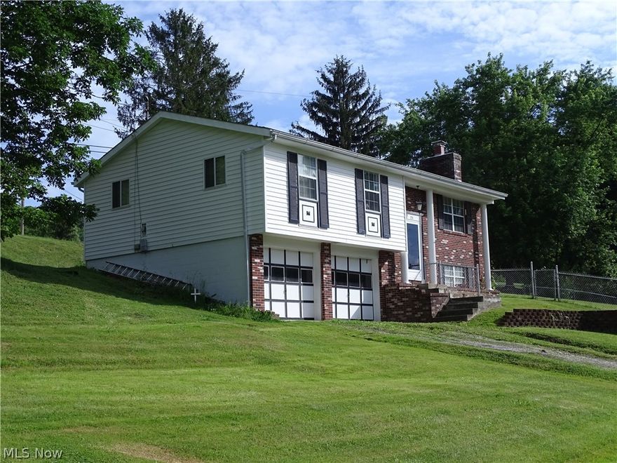 Very nicely maintained home an acre +/- lot with fenced lawn, located just outside of city and conveniently located close to everything.  This 3 BR, 2 1/2 bath home is move-in ready with updated FA/CA, huge family room with wood burning fireplace and is just waiting for your family!