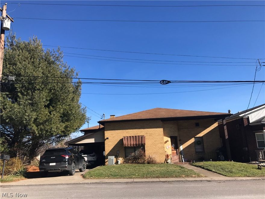 Weirton Heights Two Story up& down Duplex. Quick Access to shopping Center, schools, post office.  First floor Apt. has 2 bedrooms with hardwood floors, kitchen dining room, living room, laundry area in basement. 1 car garage. Bottom unit needs redone. Includes 1 bedroom, living room, kitchen and basement, a nice covered porch- hardwood floors in living room and bedroom.  SOLD AS IS.