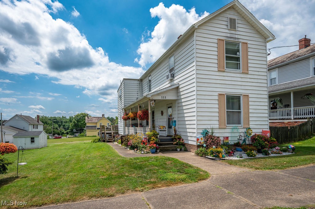 From the moment you walk up to the front of this house, you will be captivated by the colorful blossoms and charm of the covered front porch on this Harmar Hill house. This house offers more room than you can imagine from the outside. Delightfully updated, the main level features a living room, dining room, a very nicely updated kitchen with stainless steel appliances, and a sunny and bright bonus room that leads to a covered deck. This space is ideal for an office, craft room, or even a quaint guest room for overnight company. Upstairs, there is a primary bedroom and a large second bedroom. Between the two bedrooms is an open space that can be used for various purposes, such as a sitting room, gaming space, or dressing area; it is currently being used as a bedroom. The basement offers laundry facilities and ample room to store seasonal items. The one-car garage is ideal for a smaller car, motorcycles, bicycles, and any gardening equipment. With alley access, you can find plenty of parking on the gravel driveway and the rear of the house, plus on-street parking for visitors. If you enjoy walking, this is a wonderful neighborhood for evening strolls and during the annual Sternwheel Festival, you have a perfect view at the end of the street to watch the fireworks on the Ohio River. The rest of the year, you can enjoy a very scenic overlook of Marietta and the two rivers. Schedule a showing today.