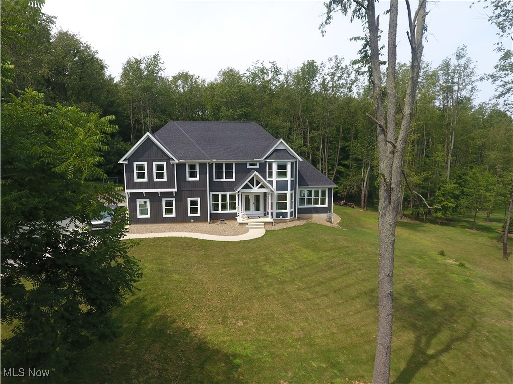 This is a newer construction home with four Bedrooms, three full bathrooms, and a half bathroom with attached oversized two car garage. The Kitchen has ample cabinets and island with granite countertops. There is a formal dining room as well as a breakfast nook/eat-in kitchen space. The Master Bedroom has a spacious walk-in closet and bathroom with granite countertops, and His and Hers sinks. The basement is mostly finished with approximately 900 additional sq ft of living space. This space includes a walk-out door onto the patio with hot tub leading to the heated swimming pool and low maintenance composite deck. There is a conveniently located full bathroom in the basement. There is an office, living room, and media/theatre room for additional entertainment. The gently sloping lot boasts a basketball court, trees, and great view of the woods. This home is in the Highland School District and close to convenient shopping and highway access.