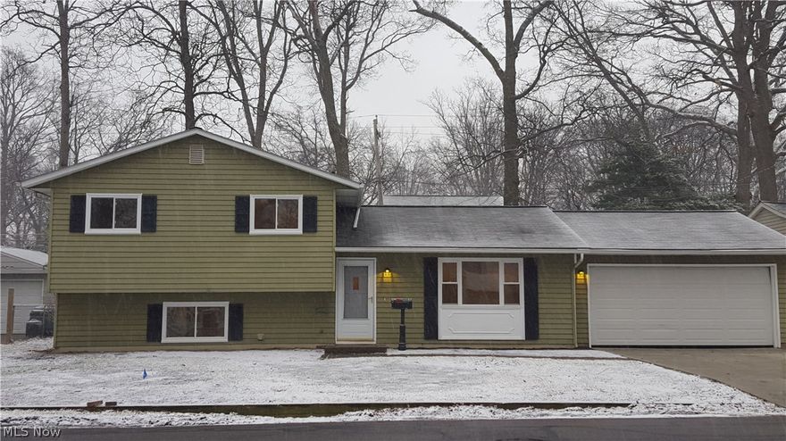 This Adorable and Charming 3 Bedroom Split has a lot to offer. Completely renovated and ready for you to move right in! All new Flooring, Freshly painted, Brand new stainless steel appliances. Great layout for Entertaining. Patio off of the Dining Room. Large full bathroom. New Concrete drive. New windows. Attached 2 car garage is over-sized. The natural light and the canned lighting throughout gives the home a bright and airy feel.  Bonus area in lower level could be used as an Office, Den, or Hobby Room. Award winning Avon Lake School District. Minutes from 1-90 and the Lake. Landscaping to be completed as weather permits.