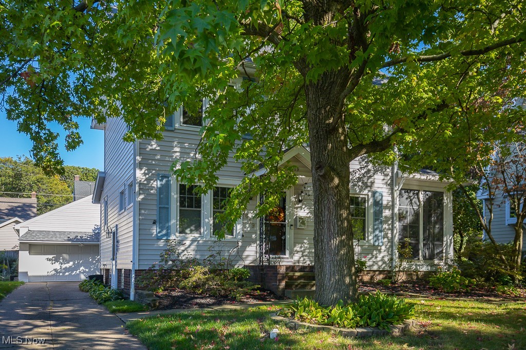 Welcome to this charming Lakewood colonial on a highly sought after street! Spacious living room with fireplace, kitchen with peninsula and plenty of cabinets and pantry, opens to dining room with glass paneled bi-fold doors, powder room relocated to side entry rather than in kitchen space. Second floor has 3 bedrooms and renovated full bath. Gorgeous hardwood floors throughout the first and second floors. Basement has finished space, laundry and plenty of additional storage. Waterproofing by Ohio State Waterproofing, glass block windows. Enjoy outdoor entertaining on the screen porch with attached large synthetic wood deck! Two car garage with raised roof for additional storage. Lovely landscaped yard! Ideal Lakewood location close to shops, dining, schools and convenient to the highway. Move right into this well maintained home! Schedule your showing today!