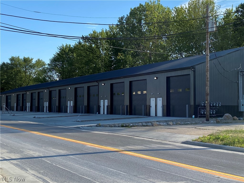 Auto lovers dream! Just completed 1,000 sq ft Storage Condo, brand new and fully loaded! 20’ x 50’ with 16’ high ceiling. Comes complete with half bath, finished and furnished loft/man cave, refrigerator, microwave, sofa, cabinet, built-in cabinets below the loft, four post lift, hose/reel, three blink security cameras, and more! Unit is heated and the loft is heated and cooled. Exceptional opportunity!