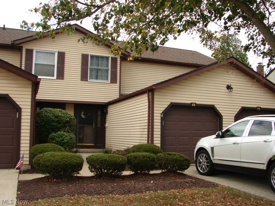 Enjoy maintenance free living in this move in ready unit. Neutral decor throughout. Updated kitchen with all appliances. Convenient half bath located on the first floor. Cozy living room with fireplace and sliders to private deck. Deck furniture can stay. Finished basement with large built in TV that can stay as well. Roomy master bedroom upstairs with spacious closet with custom built closet organizer. Large 2nd bedroom with ample closet space as well. Attached garage has direct access to home. Lots of storage space throughout. New air conditioner, 5/2015 & newer hot water tank, 12/2013. Every room freshly painted.