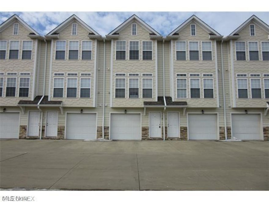 Market Square Townhome! Tri-level condominium featuring high ceilings and architectural details such as transom windows and Shaker-style maple cabinets. Clean and neutral decor with berber carpeting. First floor features a private entrance, an attached garage, laundry room and storage space. Second floor boasts a kitchen, living room with large windows which let in plenty of light and a half bath. Third floor offers two bedrooms with nice sized closets and a full bath. Great freeway access. Move-in condition!