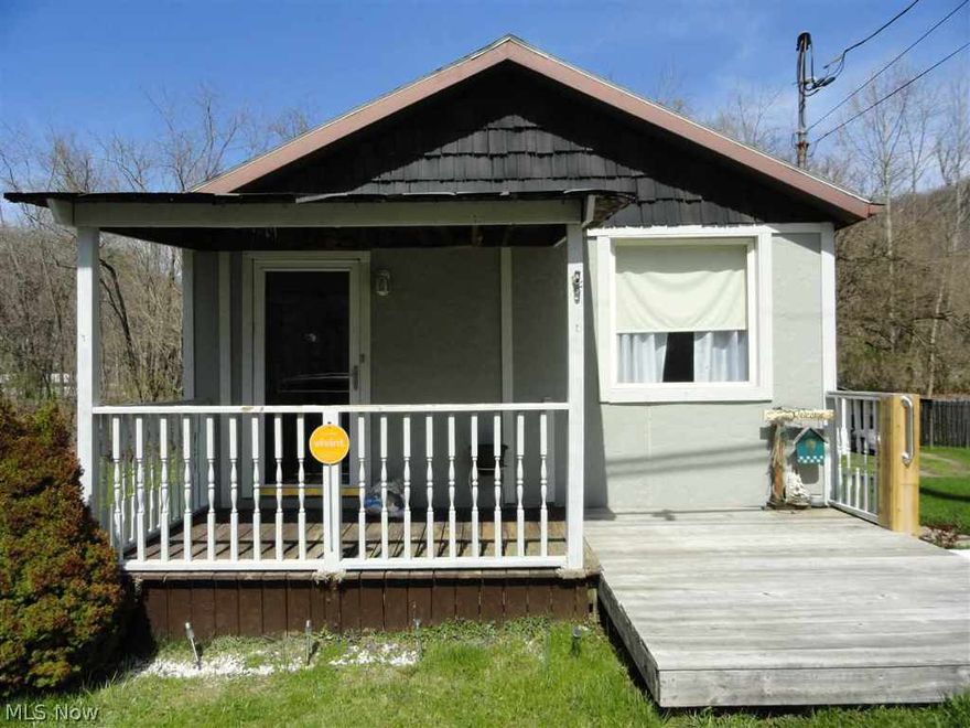 Very well maintained. 200 amp service. Furnace 10yrs, air 7 yrs, roof 10 yrs and new windows.  New flooring over hardwood. City water & sewage. Home has 4 lots.   Survey for lots. 1 car garage and carport. Owner will entertain all offers.