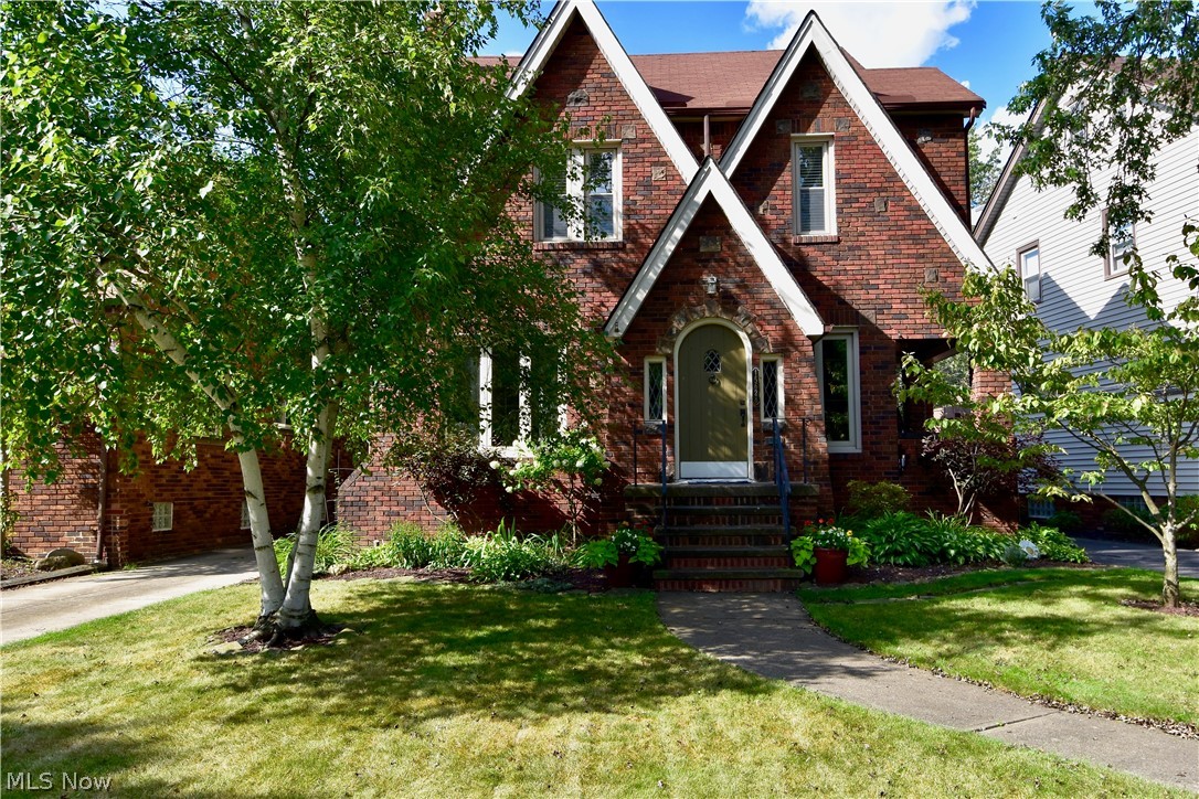 Beautiful West Park Colonial in a prime neighborhood! Near shopping, Kamm’s Corner, local parks, Metroparks and easily accessible to all major highways. Wonderful curb appeal with brick and shake exterior, side porch and eye-catching perennial landscaping. Inviting interior has entry foyer with closet, hardwood flooring, living room with stone fireplace, and formal dining room with leaded-glass built-ins. Kitchen has loads of white cabinets, granite countertop, hardwood flooring. Shaded patio off the kitchen, perfect for entertaining. Three second floor bedrooms, plus large finished third floor with abundant storage, charming sitting areas, and beautifully renovated full bath, 2019. Third floor is a comfortable master suite! Partially finished lower level with glass-block windows and plenty of additional storage. Updated electrical, including panel. Replacement windows. New roof on two-car garage, 2019. Come see.