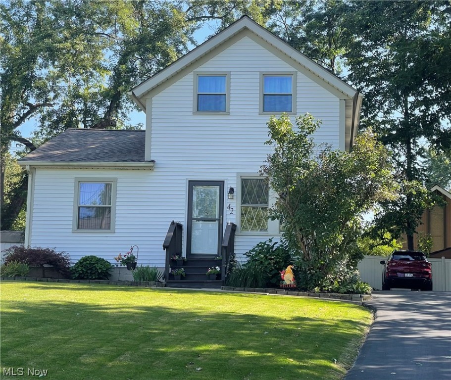 Note the tender loving care in this 1920 built Colonial. Beautifully maintained & ready for You, the new owner ! Natural light graciously floods the living area. Adjoining the living room & kitchen is the open dinette space. Updated kitchen offers plenty of cabinetry and all the appliances will stay. Kitchen offers easy access to the manicured, vinyl fenced yard for play or just simply relaxing. First floor master bedroom & remodeled full bath along with convenient 1st floor laundry complete the first level. Upstairs you will find 2 additional generously sized bedrooms which allows for an optional 2nd floor master. Newer flooring and paint throughout. Updates include roof 2015, hot water tank 2016, new asphalt driveway 2015, storm doors on both back & front of home. Newer Shed to hold all those yard toys. This precious property is steps away from shops, restaurants, & parks, including Cuy Valley National Park. Nordonia Schools. Centrally located between CLE & AKR, just min
