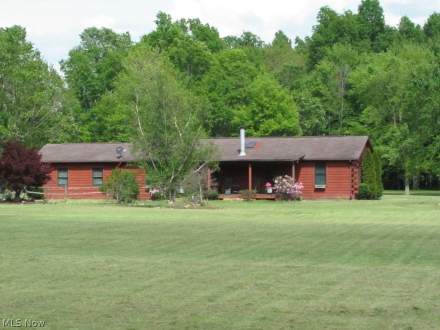 Classic ranch style log home resting on 8.5 acres.  Roughly 3 acres of lawn and 5 wooded acres.  Home features three spacious bedrooms and two full baths.  Vaulted ceilings.  Dining room leads to private back deck overlooking the back yard.  Full basement with higher ceilings offers ample storage space and is waterproofed.  Attached two car garage and detached 24X32 pull through pole building with concrete floor and electric service.  Horses permitted.  Fantastic wildlife or hunting opportunity.  Peaceful country setting with very close access to State Route 14 and 10 minutes from I-76.  Home Warranty included and move in ready.  Schedule your showing today!