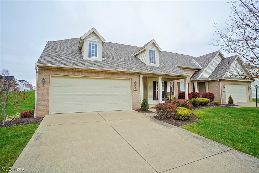 Feel the warmth and love when you walk in the front door of this super nice contemporary condo! This home features an open floor plan with vaulted ceiling in the great room/dining area, gas fireplace for the cold nights and flows into a family/sun room with access to the nice deck and view. There are many windows that allow for an abundance of light! The eat in kitchen offers plenty of cabinet and counter space (all appliances convey). First floor master suite features
a 7 x 6 walk-in closet with professional organizers and the master bath has a double vanity with beautiful recently updated tiled walk in shower. The first floor laundry (washer and dryer also convey) has a convenient folding counter and was organized for efficiency. Updated half bath completes the first floor. The second floor features an amazing loft, which is the perfect office, full bath and the spacious bedroom has amazing built ins. Be sure to push in the wall bookcase to discover a newly finished walk