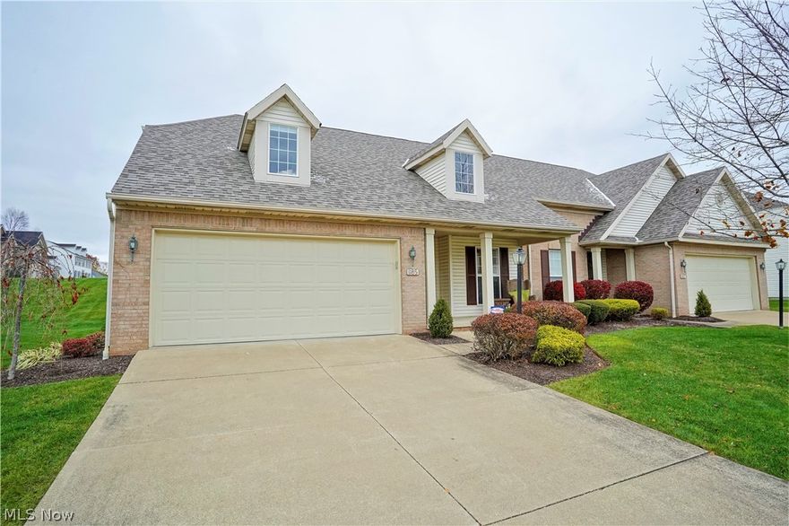 Feel the warmth and love when you walk in the front door of this super nice contemporary condo!  This home features an open floor plan with vaulted ceiling in the great room/dining area, gas fireplace for the cold nights and flows into a family/sun room with access to the nice deck and view.  There are many windows that allow for an abundance of light!  The eat in kitchen offers plenty of cabinet and counter space (all appliances convey).   First floor master suite features 
a 7 x 6 walk-in closet with professional organizers  and the master bath has a double vanity with  beautiful recently updated tiled walk in shower.  The first floor laundry (washer and dryer also convey) has a convenient folding counter and was organized for efficiency.  Updated half bath completes the first floor.  The second floor features an amazing loft, which is the perfect office, full bath and the spacious bedroom has amazing built ins.  Be sure to push in the wall bookcase to discover a newly finished walk