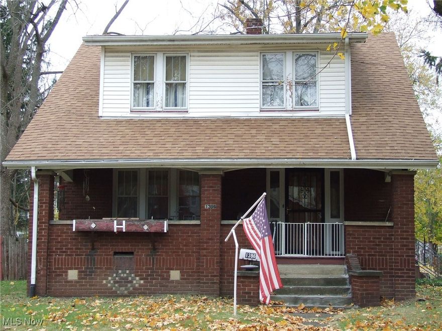 Charming 4-bedroom Brick, center hall Colonial with a lot of its original charm maintained by the same owner for the last 50 years!  Hardwood floor under carpet in the living room and in the 4 bedrooms.  Living room has beautiful, extra wide oak front door, original natural oak woodwork and crown molding, stone fireplace with built-in desk on one side and glass-door bookshelves on the other side, also an original chandelier with co-ordinating ones in the bedrooms.  Newer LVT in dining room along with window seat with drawers.  The kitchen has an original actual farmhouse sink that could use some work and original farmhouse style 2-tone cupboards with original hardware pulls.  There's even a "murphy-style" table and bench that pulls down out of the wall!  Outside still has the old milk box for delivery and the coal chute.  Homey front porch to watch the traffic go by.  There's a 2-car garage attached by a breezeway that also leads to the fenced backyard with small patio and shed.