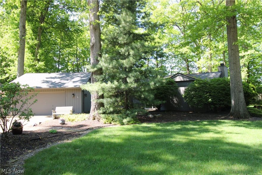 Immerse yourself in the tranquility of this sprawling ranch home nestled in a cul-de-sac in the desirable Mills Creek East Subdivision of North Ridgeville Township. This meticulously maintained property boasts 4 bedrooms, 3 bathrooms, and a wooded lot, providing a haven of peace and privacy. With it's mature trees and beautiful seasonal greenery, you can sit on your deck and watch the many bird species that call this yard home. The living room has a wood burning fireplace and is connected to a formal dining area with a wall of built in cabinets.  In those built-ins is a hidden WET bar for ease of entertaining for the holidays and special events!  The kitchen has an open floor plan enveloping the family room area.  A wall of glass sliders separate that area with the expansive game room with a pool table, foosball table and a wood burner.  The game room (an additional approx. 564 square feet of space) is bordered by a full wrap around deck with entry out of each side of the room to the courtyard.  A shed is placed in the back of the property for extra storage. The primary suite includes an en-suite bath and "his & hers" walk in closets. The three additional bedrooms share a full bath. This home has been cared for and treasured for many, many years. Recent updates include: Hot water tank 2023, Roof 2017, gas piped from the street up to the home. Contact your Realtor and schedule your showing today!