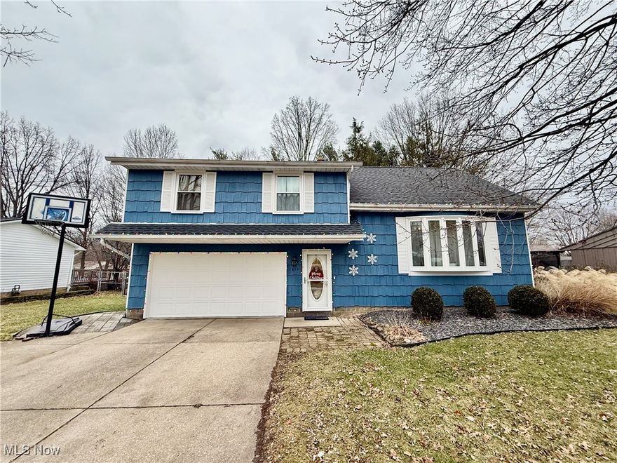 Welcome to this fabulous split-level home situated on a fantastic lot with four spacious bedrooms! Inside, you'll find a large living room featuring a stunning picture window and beautiful hardwood floors. The formal dining room offers a sliding glass door that leads to a deck and the backyard, perfect for entertaining. Throughout the home, you'll notice fresh, neutral paint that adds to its bright and airy feel.The kitchen provides ample cabinet space, and best of all, ALL appliances stay with the property. Upstairs, you'll find four generously sized bedrooms and a full bathroom. The master bedroom, located on the third level, is truly massive and comes with a walk-in closet.The finished family room in the basement adds plenty of additional living space, and there's a bonus room that could serve as a play area, pantry, or even an office. The basement also includes a laundry area and extra storage.The attached two-car garage offers even more convenience. With all of these fantastic features, you wont find a better value in Stow! This home is truly move-in ready with to many updates to list.