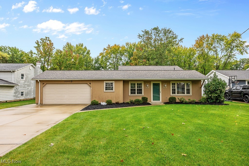 Welcome to this charming 3-bedroom, 1.5-bath split-level home, perfectly maintained and ready for you to move in! As you enter, you'll find a cozy dining area to your left that seamlessly flows into the eat-in kitchen, ideal for family gatherings. The spacious living room is perfect for relaxation and features easy access to the expansive lower level, which includes a convenient half bath and laundry area. Venture upstairs to discover three comfortable bedrooms, all well-appointed, and a full bath that completes this level. The kitchen boasts a slider that opens up to a concrete patio, perfect for outdoor dining and entertaining, overlooking a generous backyard that sits on a half-acre lot—ideal for play, gardening, or simply enjoying the outdoors. This home also comes with a home warranty for your peace of mind. Don’t miss the opportunity to make this lovely property your own!