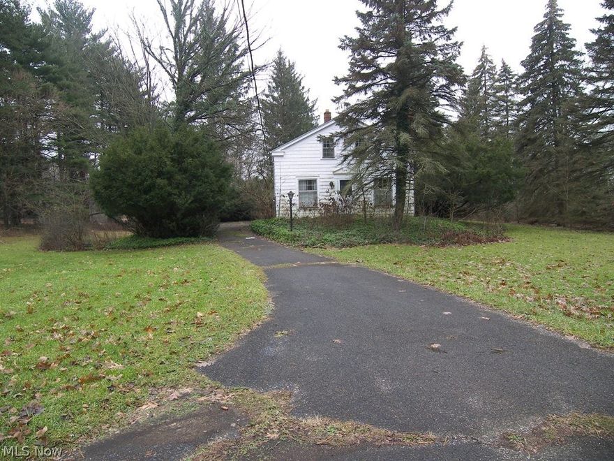 Incredible North Solon opportunity! Almost 4.5 acres of park like, wooded setting with a pond. This private setting is just minutes from 422. This could be one special home site or perfect to divide into two home sites for a family set up or to build two spec homes. The property is fully improved with all utilities. The current house is not habitable. Extensive work would be needed to make this a home so this property is best used for you to build your next home or homes.  There are three springs on the property, one of which feeds the pond. With over 300 ft of frontage, the options are endless. This is a very rare opportunity to have almost 4.5 acres in Solon Schools, minutes to 422 and all the privacy you could desire. This can only be purchased with cash or a renovation loan if you are renovating the existing house.