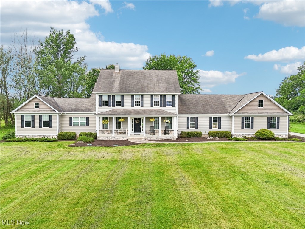 Welcome to this charming 5 BR, 3.5 BA home on 3 peaceful acres in the West Geauga Schools; a short drive to Chagrin Falls brings you to shops and restaurants. The first floor boasts a beautifully updated, eat-in kitchen with maple cabinets, granite counters, walk-in pantry, copper sink, and wet bar. The kitchen is open to the bright family room with gas log fireplace surrounded by a structured wood wall. The newer back hall mudroom with built-in cubbies, dog kennels and a first-floor laundry leads to the ½ bath and kitchen. The first floor owners’ suite features a sitting room, vaulted bedroom with a charming barn door, French doors to a private deck and hot tub, large walk through closet with built-ins and a gorgeous bath with separate shower, dual sinks, private commode room and built-in chest for linens. An open stairway leads to the second floor, featuring another owners’ suite with walk-in closet and private bath. There are three other bedrooms with generous closet space plus a second floor laundry. The lower level is finished into a large entertainment/ bar area with two separate rooms for office or workout space, currently used for the owner’s recording studio. The main deck was rebuilt in 2022 and a lovely stone patio overlooks the expansive yard. The oversized 3-car garage has extra room for storage. Recent upgrades include exterior drainage (2025), sump pump (2025), furnace (2024) and radon system (2023). Close to major hospitals and a short drive to shopping and restaurants, you’ll enjoy the best of both worlds this lovely home as to offer!