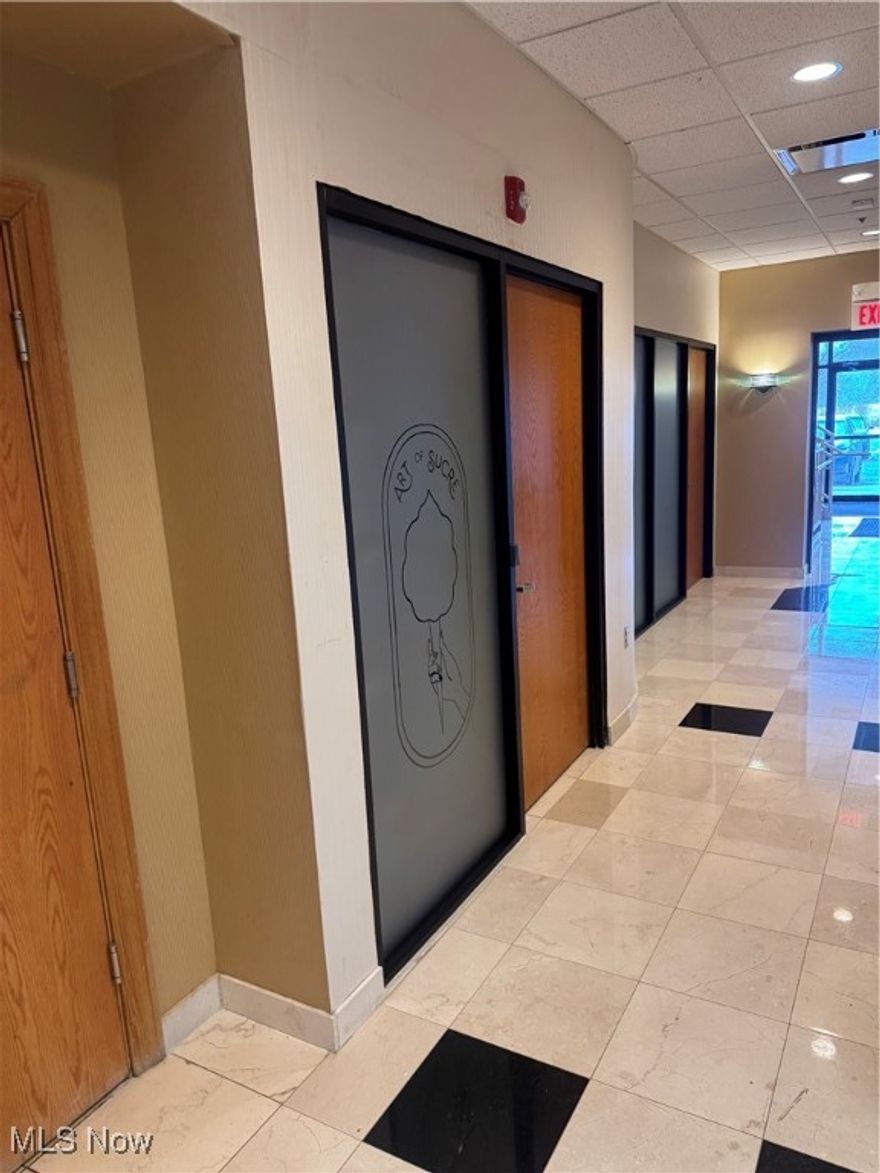 Professional class A office/medical condo located in a well-maintained Fairlawn complex. Ground-level unit offers excellent accessibility and a functional layout suitable for medical, dental, therapy, or general professional office use. The property features ample parking, attractive common areas, and a professionally managed association. As you walk in the front door is an amazing reception area with a waterfall on wall. Pristine bathrooms on all levels, easily accessible through the elevator or stairway.  Underground parking for steady year-round safety and parking for unit owners. Conveniently situated near I-77, Route 18, and I-71, with quick connections to Akron, Cleveland and Canton. Surrounded by professional offices, retail, dining, and lodging in the Fairlawn/Montrose area.