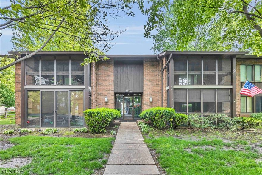 Rare opportunity in Woodscape Condominiums for a great alternative to renting and located right across from community in-ground pool!  Quiet second-floor unit boasts an open floor plan, beautiful wood flooring, and a covered patio for relaxing and entertaining!  The large primary bedroom offers an en suite bath and ample closet space, while the in-unit laundry adds every day convenience! Second bedroom has double closet and hardwood under carpeting. Large kitchen with ample workspace and cupboards with all appliances staying. Dedicated storage closet down the hall, and a detached/shared one car garage complete this home!  Don't let this one slip by!