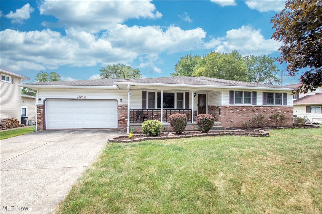 Welcome home to this 3 bedroom & 2 full bath ranch on a half acre lot that has been lovingly cared for by the original owners since 1968. It offers an open floor plan with 1302 square feet of above ground living space plus a spacious finished basement. Upon arrival, you will love the curb appeal of this home & the inviting front porch. Step inside the front door to the ceramic tile foyer that opens to the spacious living room. This living room has a large picture window flanked by 2 double hung windows allowing plenty of natural light. Beyond the living room is the formal dining room with a sliding glass door that leads to the covered composite deck in the back yard. At the heart of the home is the eat-in kitchen. It has ceramic tile flooring, plenty of oak cabinets, corian counter tops, ceramic tile back splash & comes with the range, refrigerator, microwave & dishwasher. There are 3 nice sized bedrooms on the 1st floor plus a full bath. The bath was updated with a newer tub and marble shower surround. All the carpeted areas on the 1st floor have hardwood floors underneath (see photos.) The lower level offers a huge recreation area perfect for entertaining. There is a sitting area with a fireplace & built-in bookshelves, a large bar, a full bath, a workshop, bonus room that could be an office or craft room, & the laundry area with washer & dryer included. You will definetely recognize the pride of ownership in this home. It has a 2 car attached garage with Naturestone flooring, and an huge backyard with a large shed the current owner used as a wood working shop.