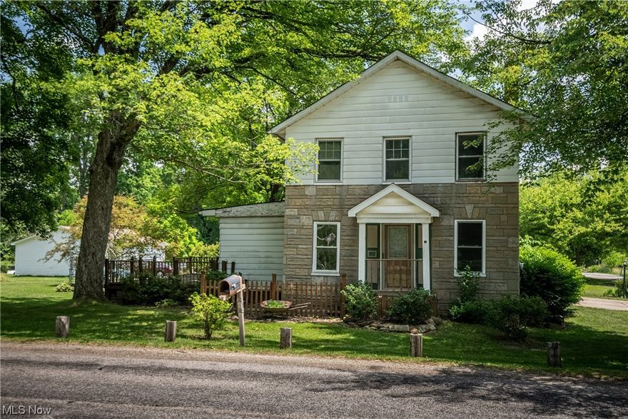 This charming 3 bedroom, 1 bathroom home is perfect for those seeking a cozy and comfortable living space. Situated on the corner of Warner Road and Everett East road, this property offers so much potential to create your ideal home. The front porch with so much charm and character welcomes you into the large living room with a brick fireplace and lots of windows bringing in natural light. The open concept kitchen and dining room are just around the corner. The kitchen offers plenty of storage space and a breakfast bar area. Upstairs, you'll find 3 bedrooms and a large bathroom. Also, stairs lead up to attic space for extra storage. A beautiful sunroom has double doors that lead to your large back deck that steps down into your flat, spacious backyard. An oversized 2 car garage with a workshop completes this home with so much potential. The space is here, you just have to make it your own!