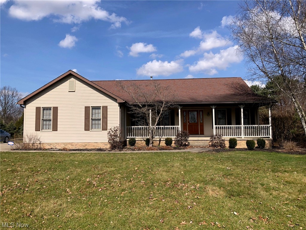 Custom built ranch on 2.56 acre lot. Relax and enjoy the seasons sitting on the open front porch. Foyer entrance that opens into the dining room with tray ceiling. Great room with corner gas fireplace. Fully applianced kitchen and eating area with bay window. Sun room featuring a cathedral ceiling and wall of windows overlooking the backyard. The sun room has a sliding glass door to the deck. Split floor plan with primary bedroom off of the kitchen. The primary bathroom has a jetted tub, separate stall shower and spacious walk-in closet. On the right side of the house are 2 additional bedrooms and the main bathroom. Natural woodwork throughout. Partially finished basement with large rec room and half bath. Semi-finished bonus room for storage or craft room. Call today to schedule your appointment to see this well maintained home.