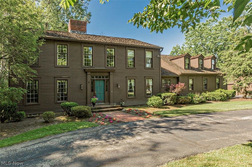 Welcome to this wonderful Chesterland home! Upon entering this spacious 5 bedroom & 3.1 bathroom colonial-style home you are warmly greeted with views of the beautiful living room and dining room. Leading you into the study and grand family room with windows through-out allowing you to view the serene nature located right outside. Beautiful hardwood flooring and a brick fireplace make you feel right at home. Topped off with granite counter tops, stainless steel appliances and ceramic tile the kitchen feels fresh and clean. Interconnection between the family room,kitchen and outdoor patio allow for easy flow for gatherings of any size. The 2nd level leads you into the large Master Suite with an on-suite bath. Three additional bedrooms host plenty of closet space and sunlight. In additional to the main home, an in-law or guest suite allows for a private retreat.  Enjoy this luxurious home inside and out. The double doors from the family room or kitchen lead to a wooded back patio which gives excellent views of the outdoors right in the backyard. Follow the inlaid brick path from the patio straight to your fenced inground pool. Intricately designed lush landscaping allows friends and family to enjoy your 5 acres with the peace and privacy desired. Located in Chesterland, this home will give you the suburbian feel desired while also allowing for privacy by being located on a dead-end street.