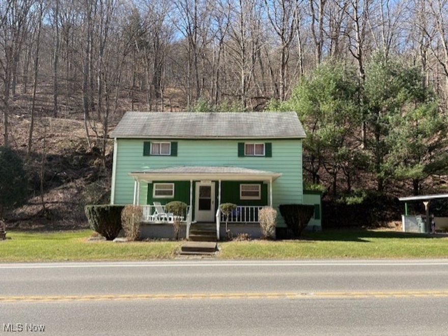 2 story home in Empire with 2 detached garages. House sits on 3.20 acres and there is an additional 5.70 acres across the street. Mostly wooded property. Property that the house sits on has a new survey. The Well has been inspected by JCHD and passed. Septic is going to need to be replaced. Owner has had soil scientist draw up a design for a new one and we are in the process of getting quotes. Home is adorable. Living room, eat in kitchen, 1 bath, 1 bedroom and a nice family room on the first floor. family room has a wood burning fireplace and an artificial electric fireplace in it. 2 very large bedrooms upstairs with tons of closet space. Enclosed patio goes from family room to the side of home. 2 detached garages.  The one to the right of home also has a carport or patio attached. Seller is willing to accept  cash offers in as is condition.   Seller is keeping the mineral rights.