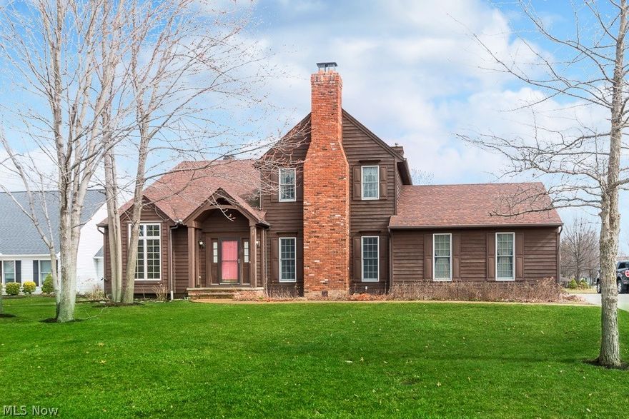 Welcome to this charming colonial in the heart of Avon Lake.  This custom designed home will warm your heart from the moment you walk in.  A two story foyer greets you with knotty pine flooring which flanks a vaulted great room on your left and an inviting family room boasting those stunning wood floors, beamed ceilings and fire place on your right.  You will love the open and updated kitchen with quartz counters, large center island and exquisite built shelving.  Off the kitchen is a spectacular wooded  three seasons room and patio,  Three spacious bedrooms, all up ,including the owners retreat with private bath and fire place, you'll feel like you have stepped into a cabin retreat.  The Full basement has been partially finished for added living space and great side load garage all this and so much more awaits you.  Call today for your private tour.