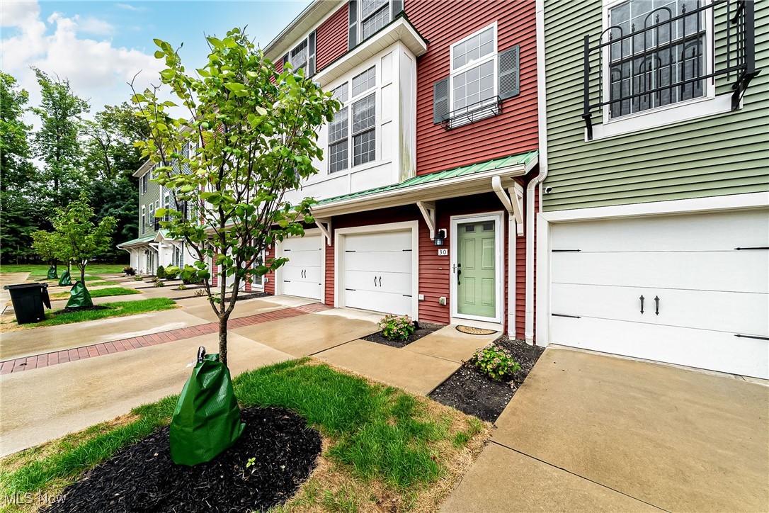 Welcome to this stunning modern townhouse in the sought-after Grandview community of Rocky River! ***Check out the 360 Degree Panoramic Virtual Tour and Floorplans!*** Built in 2014, this 3-bedroom, 3.5-bath home offers over 2,000 sq. ft. of beautifully designed living space with an open concept floor plan, tall ceilings, and gleaming hardwood floors. The first floor features a versatile bedroom with a private full bath and access to a deck—perfect for a guest suite, home office, or in-law space. Upstairs, the second floor is the heart of the home with a large eat-in kitchen showcasing tall cabinetry, granite countertops, a spacious center island, and a walk-in pantry. The kitchen opens seamlessly to a dining area, built-in office nook, and bright living room. Step out to the private deck overlooking greenspace, creek, and woods for a peaceful retreat. A convenient half bath completes this level. The third floor hosts the luxurious primary suite with a walk-in closet, ensuite bath, and laundry for ultimate convenience. An additional bedroom with its own ensuite bath rounds out this level, offering privacy and comfort for family or guests. Additional highlights include an attached 1-car garage with direct unit access, two outdoor decks with wooded views, abundant storage throughout, Energy-efficient construction and central air. Ideally located near Rocky River Recreation Center, schools, shopping at Westgate & Crocker Park, playgrounds, and Lake Erie parks—plus easy highway access for a quick commute.
This well-planned, move-in ready home combines modern style, community living, and prime Rocky River convenience. Don’t miss your chance to make it yours!