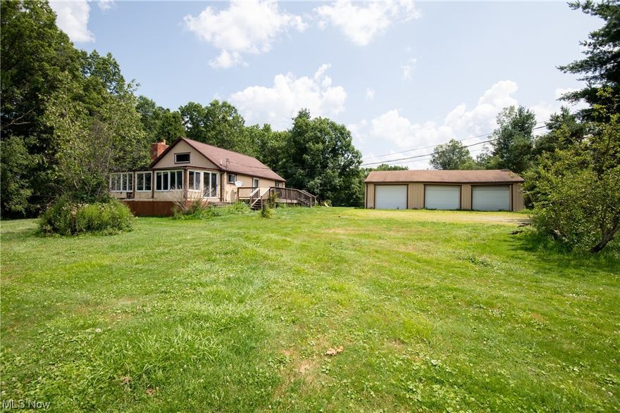 Prime time country living here on this gorgeous 13 acre property!  This idyllic piece of land features two ponds, a creek, plenty of field space for gardens or livestock, a three car garage and the coziest cabin in the county.  The home features vaulted ceilings in the open living room/kitchen.  Finished basement for office space, guest rooms, work out area, you name it.  Turn off the lights and enjoy a fire in the natural stone fireplace.  The three car garage is perfect for storing tractors, vehicles, wood shop, you name it!  Refrigerator, range, microwave, washer and dryer all stay with the home.  Furnace uses propane which costs approximately $900 per year to heat the home.  Front porch and garage are in need of a little TLC.  Home is being sold as-is.