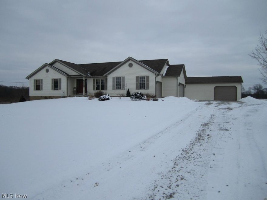 Many upgrades in this quality constructed ranch home. This lovely Country home sits on 2 acres with a flowering pear-tree lined driveway. Home boasts beautiful sunrise views from the back deck. The eat-in kitchen is sure to please with ample cupboard space and beautiful updated counter tops and sink. The open floor plan from the kitchen to the living room offers hardwood floors, vaulted ceilings, fireplace, and wonderful natural lighting. The master bedroom has a walk-in closet and master bath. The fourth bedroom in located in the basement. This bedroom also has a large walk-in closet. 3 of the bedrooms have been newly carpeted (one of the bedrooms has hardwood floors) The walk-out basement is a perfect place to add a family room. Not only is there a three stall attached garage, there is also a detached 40x24 pole building. Additional features included: Fruit trees, berry plants (blueberry, blackberry, and strawberry), established garden, and fenced-in 40 X 55 area with small 12' X 15'