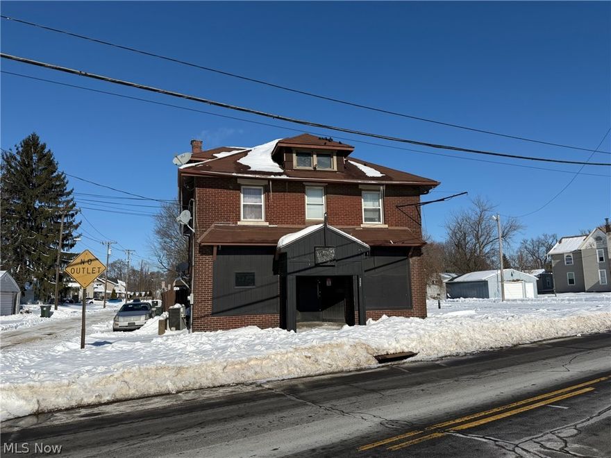 Mixed Use Building. All brick building with retail space on the first floor and an apartment on the second floor. The retail space is currently used as a party center which has a kitchenette and two restrooms. There is a fenced in patio area in the back of the building that has a converted garage with an outside entertainment center. The apartment has access from the outside. Both the retail and apartment are currently occupied. Lots of parking.