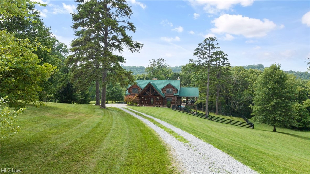 Welcome to 83 Liberty Lane, a charming lodge-style log home that exudes warmth and character. Located in a peaceful neighborhood, this property offers a unique blend of rustic charm and modern convenience.
As you step inside, you'll be greeted by a spacious open-concept layout that is perfect for both entertaining and everyday living. The living area boasts soaring ceilings, exposed wood beams, and a cozy fireplace, creating an inviting atmosphere where you can relax after a long day. The whole house generator ensures peace of mind.
The master bedroom is a true oasis, boasting a heated floor in the ensuite bathroom for added comfort and luxury. With two possibly three additional bedrooms and five bathrooms in total, there is plenty of space for everyone in the family.
Step outside into your own private paradise. The large above-ground pool is perfect for cooling off on hot summer days, while the stamped concrete patio provides an ideal spot for outdoor gatherings. The deck features a fireplace and hard plumbed gas grill, making it an excellent place to entertain year-round.
Other notable features of this property include new fencing, Trex decking with new railings, a detached two-stall garage, and a large outbuilding that offers endless possibilities.
Conveniently located, this home offers the perfect combination of privacy and accessibility. Don't miss out on the opportunity to make Liberty Lodge your forever home. Call today to tour this amazing home!