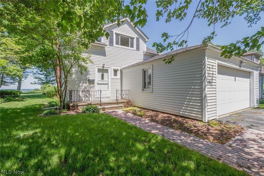 Spectacular views of Lake Erie and downtown Cleveland.  MAKE AN OFFER!  This home is a great place to start building your dreams, whether it's remodeling/expanding or starting from the ground up! The current home is a 2 bedroom, 1.5 bath Cape Cod with a 2 car attached garage. Kitchen appliances are included. The great room offers a fireplace, wood floors and plenty of windows to help you enjoy the view from inside.  Freshly painted interior and new neutral carpet!  At the back of the home is a deck.  If you're looking for unobstructed views, this property offers it! Make this your special place!  This property is part of the Eagle Cliff Park Association.