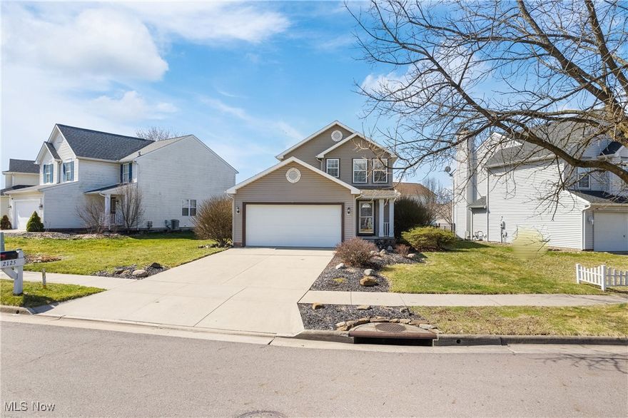 Charming 3-bedroom Colonial located in a desirable neighborhood with easy access to local amenities. The open floor plan creates a bright and spacious living area, complemented by fresh, neutral tones throughout. The fully applianced kitchen offers ample storage and flows seamlessly into the living and dining spaces. Enjoy the convenience of first-floor laundry. Sliding doors lead to a custom paver patio, perfect for outdoor gatherings. The finished rec room in the lower level provides additional space for entertainment or relaxation. This home is a must-see!