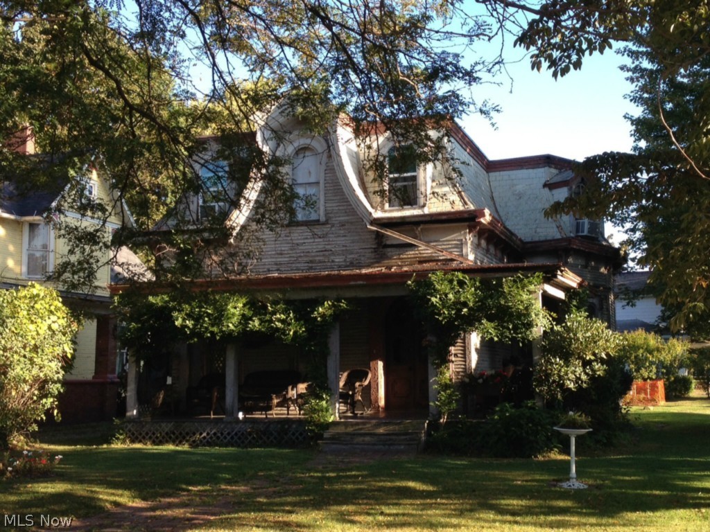 Victorian with tons of character. 5 fireplaces with beautiful mantels, original pocket doors, stained glass and huge rooms. 2 gas furnaces. Sells AS IS, seller will make no repairs. Corner lot