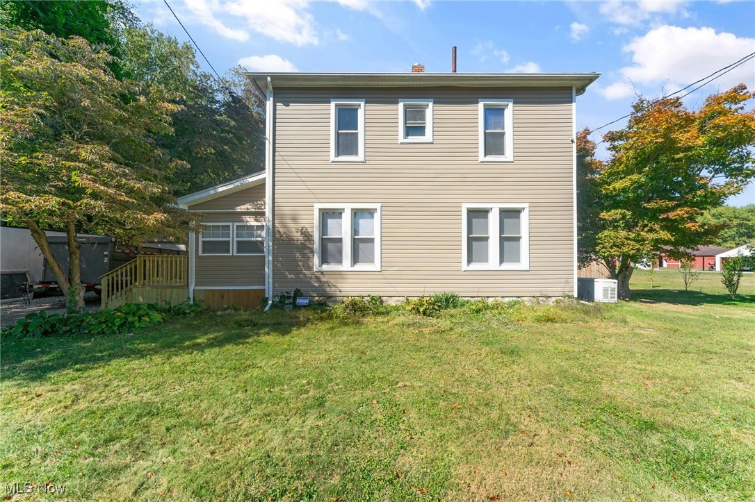 Move right into this beautifully remodeled 3-bedroom home with the potential for a 4th bedroom in the finished basement, offering 2 full bathrooms and plenty of updates throughout. The exterior shines with excellent curb appeal featuring newer vinyl siding, a dimensional shingle roof, a brand-new side deck, a back deck overlooking the yard, a newer 2-car steel garage, and even a shed equipped with a mini split for heat and air. Inside, the side entry leads into a spacious living room with fresh laminate flooring and a stunning electric fireplace accented with tile. The eat-in kitchen is a showstopper with granite countertops, subway tile backsplash, solid wood cabinets, and stainless-steel appliances. A versatile back area can serve as a dining space with direct access to the deck, while the main floor also offers a full bath with vaulted ceilings, a tiled walk-in shower, new vanity, and updated fixtures. Upstairs you’ll find three bedrooms with new flooring and a second remodeled bathroom featuring a tub with tiled walls, new vanity, and toilet. The basement provides additional living options with a finished room perfect for a playroom, office, or bedroom, plus tile flooring, a laundry area, and plenty of storage. Major mechanicals include a high-efficiency furnace and central air, hot water tank, and 100-amp panel. Located in the desirable Hubbard School District, this home is completely move-in ready and waiting for its new owners