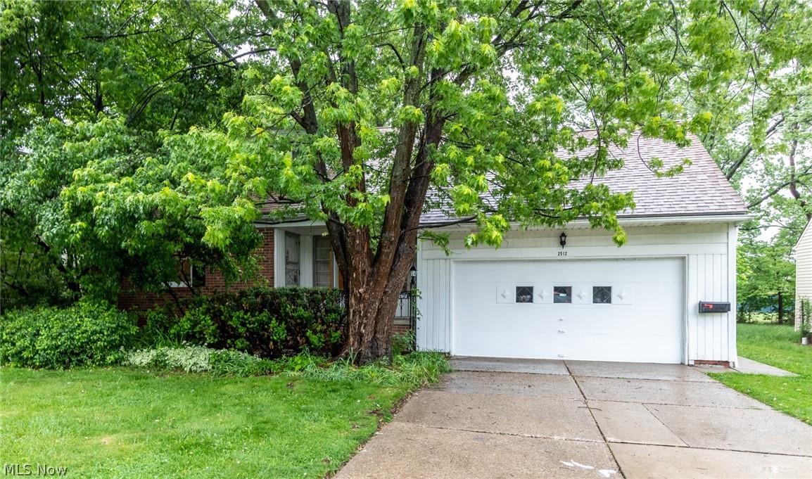 Great opportunity to own a home on prime University Heights block! Offering 4 bedroom Cape Cod with 2 full baths and lots of storage with spacious rooms, oversized two car attached garage and private back yard that is adjacent to John Carroll University with a buffer. Formal living room off entry has coved ceiling molding and hardwood under carpet. Large dining room with hardwood under carpet leads to lovely sun porch in the back. Mostly newer windows throughout with the exception of the living and dining room picture windows. Master and second bedroom on first floor share a full bath with stall shower. Eat in kitchen with sunny spot for dining leads to basement with ample storage and lots of heavy duty shelving. Upstairs are 2 super sized bedrooms with hardwood floors that share a full bath. Large insulated attic space for potential expansion has automatic exhaust fan. Newer roof. Won't last! Seller selling "as is" and buyer to assume University Heights Point of Sale inspection report
