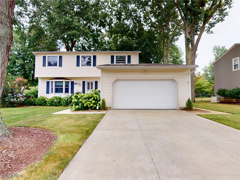 Welcome to this stunning Colonial located in the highly desirable Pinegate community in Mentor. This spacious and well-maintained home offers a perfect blend of character, modern updates, and thoughtful design.
Step into the large remodeled family room, featuring a cozy gas fireplace, elegant oak wood trim, custom built-in bookcases, and soaring cathedral ceilings. Beautiful Andersen windows provide natural light and views of the lush backyard. The adjacent kitchen boasts tall oak cabinetry, a stained glass cabinet front, granite countertops, a designer tile backsplash, extra-deep sink with backyard views, and a charming coffee station.
The first floor also features an updated half bath, a formal dining room with luxury vinyl plank flooring, and a carpeted living room with a large bay window for added natural light.
Upstairs, the oversized primary suite includes a private office or library nook, a spa-style bathroom with a deep Jacuzzi tub, separate shower, large vanity, and a stunning walk-in closet with additional storage. Three more generously sized bedrooms, all with ample closet space, and a full bath complete the second floor. Designer blinds are featured throughout the home.
Off the garage, you'll find a spacious laundry/mudroom with washer/dryer, laundry tub, cabinetry, and a walk-in pantry. The partially finished basement has been professionally waterproofed by Ohio Waterproofing with a lifetime warranty, includes a sump pump, and features a brand-new furnace and A/C (2024) and humidifier.
Enjoy the beautifully landscaped, wooded backyard from your large deck, a peaceful retreat surrounded by nature. The five mature white oak trees along the side of the property are not only striking but hold significant monetary value.
Additional features include a 2-car attached garage, ample storage throughout, and access to Pinegate amenities. This is must see Mentor gem.