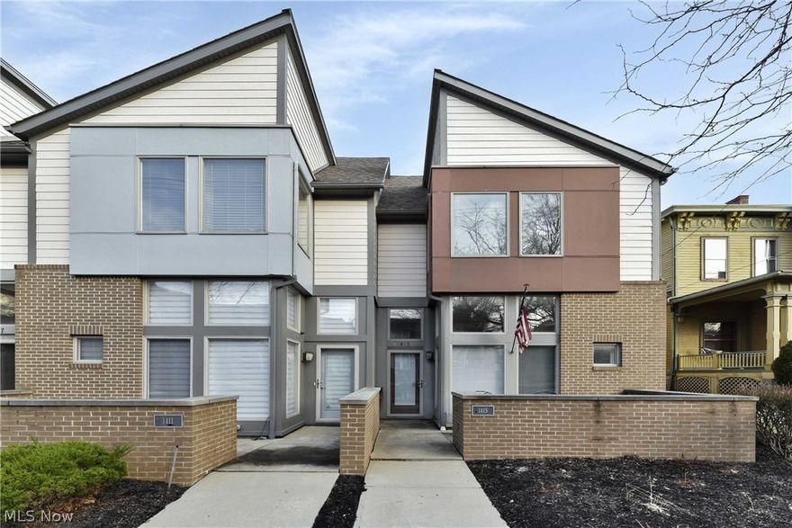 Premium end unit Rockport Square town home home built with comfort in mind. Come home every day to a breathtaking entry into an open concept living and dining area with soaring ceilings, unique windows and lighting fixtures, a fireplace and exposed ductwork. This unit goes on and on in it's floor plan. First floor master and laundry room. Enjoy time on the front porch or retreat to the secluded courtyard area off of the dining area. Kitchen features custom cabinetry, granite countertops, high end lighting and stainless steel appliances. (Refrigerator will be replaced with a comparable one.) Second floor includes two large bedrooms with full bath including soaking tub. Also on the second floor is a large loft area that could serve multiple uses.  Lots of storage. Access to 2 car garage through the unit and one additional assigned parking space included. Close to shopping, dining and beautiful Edgewater Park!