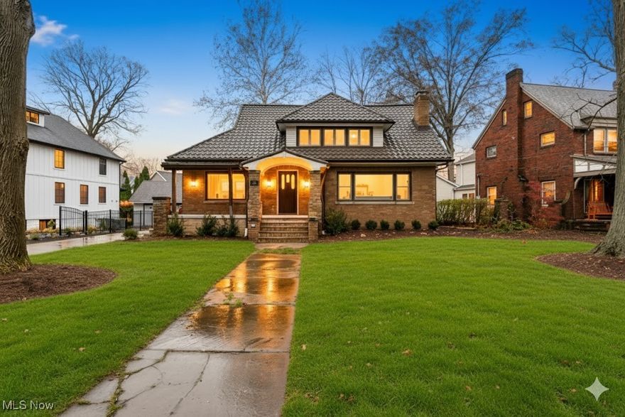 Welcome to 380 Elmwood Rd, where timeless elegance meets modern living in this exquisite all-brick colonial home. Nestled in the vibrant heart of Rocky River, this residence features 3 car garage, 5 bedrooms, 4 full bathrooms, making it an ideal sanctuary for families & entertaining guests. As you step onto the inviting front covered porch, you’ll sense the warmth & charm radiating from this property, encouraging you to relax while enjoying views of the beautifully landscaped surroundings & just a few streets away from the lake. Beautifully remodeled interior combines historic character w/ contemporary flair. The heart of the home is the stunning kitchen, a chef’s paradise equipped with gorgeous quartz countertops, high-end stainless steel appliances, & luxurious marble flooring. The spacious breakfast island, illuminated by elegant pendant lighting, is perfect for casual dining. A cozy coffee bar, complete with a wine fridge & delightful built-in cabinetry, enhances the functionality & charm of this culinary haven. Flowing from the kitchen, the inviting Great Room features a striking fireplace & refinished hardwood flooring, adding to the home’s overall warmth. Main level also includes a practical mudroom area, ideal for organizing daily routines. The dining room, bathed in natural light, creates an inviting atmosphere for memorable gatherings.Each bedroom is thoughtfully designed, with the master suite serving as a tranquil retreat. The ensuite bathroom is a luxurious escape featuring exquisite heated marble flooring, a soaking tub, a custom shower, & dual sinks topped with beautiful quartz. The fully finished basement is an entertainer’s dream, perfect for cozy movie nights or game gatherings, complete with an additional fireplace & a full bathroom. Gourgeous backyard features stamped concrete, providing a lovely outdoor space for relaxation. Home has been waterproofed for peace of mind, & a tankless water heater ensures efficiency. Call today for a private tour