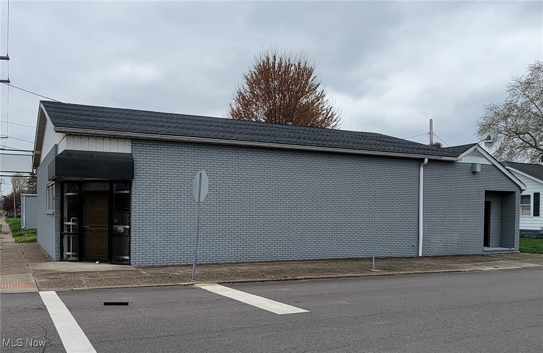 Don’t miss this incredible opportunity to own a multi-purpose commercial space ideally situated on a high-visibility corner lot, convenient to both the north and south ends of town. The main building offers 2,122 square feet of flexible space, including a spacious retail area, a half bathroom, and additional office rooms toward the back—perfect for a variety of business uses. A separate garage/storage area adds an additional 968 square feet and features a large garage door, ideal for storage, a workshop, or expansion possibilities. Bring your vision and make this space your own. Schedule a showing today and explore the endless possibilities this property has to offer!