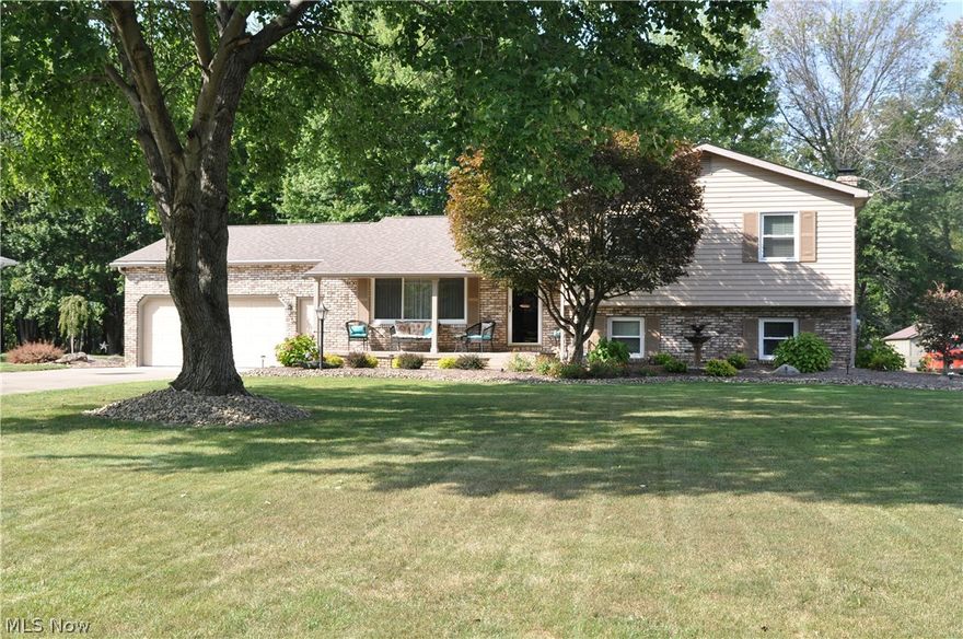 Don't miss this spectacular 4-level Howland split featuring a vaulted ceiling in living room & dining room, remodeled kitchen 7 baths, fabulous vaulted year-round sun room, family room w/fireplace, 3 spacious  bedrooms, covered front porch, beautiful extensive landscaping & park-like back yard.