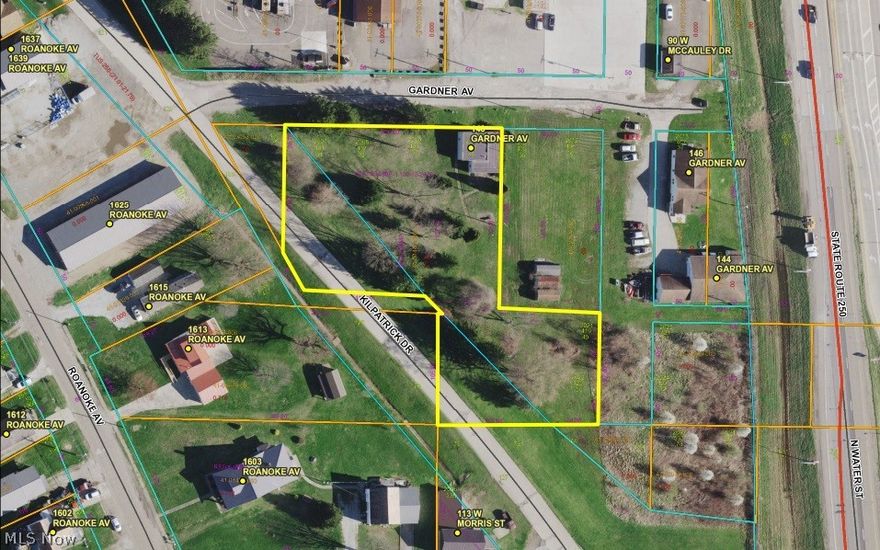 1.1 Acre Lot in Uhrichsville! Level lot with easy access and high visibility just off McCauley Drive and US Rt 250 Intersection.  Many established businesses already nearby and daily traffic counts near 30K.  City utilities on site and zoned B and I (Business and Light Industry).  Call agent with questions or to view!