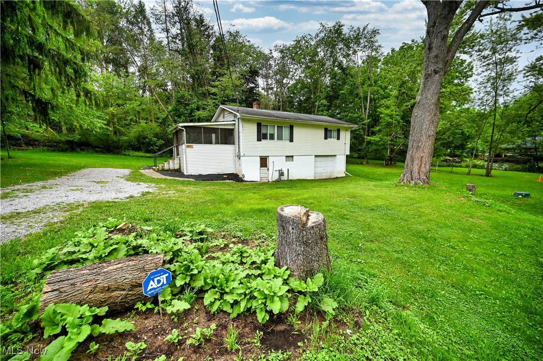 Cozy two-bedroom home on three lots totaling 2.4+ acres in St Clair Township and Beaver LSD. The main floor has two bedrooms, a full bathroom, a spacious living room, and an eat-in kitchen. The side of the home has a large screened-in porch that also functions as a mud room. The basement features a one-car garage, a laundry area, and ample storage space. The septic system was installed in 2022, and the tankless water heater is new.