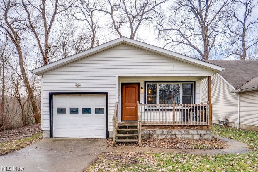 Don’t let the square footage fool you—this charming ranch offers over 900 square feet of thoughtfully designed, single-floor living and feels much bigger than it looks from the outside. Painted in neutral tones and featuring durable LVP flooring throughout, the home is bright, welcoming, and move-in ready. A large front window fills the living room with natural light, highlighting the updated space. The kitchen features oak cabinetry, stainless steel appliances, and generous counter space—perfect for everyday cooking and entertaining. The full bath has been tastefully updated with farmhouse charm, creating a warm and inviting retreat. All three bedrooms are generously sized, offering comfortable and flexible living options. A covered front porch welcomes you home and provides the perfect spot to enjoy your morning coffee or unwind at the end of the day. Inside, the functional layout maximizes every square foot with an easy, efficient flow between living spaces. The attached one-car garage adds convenience and extra storage—especially appreciated during Ohio’s changing seasons. Downstairs, a large basement offers endless possibilities for a home gym, recreation area, or additional storage. Whether you’re looking to downsize, purchase your first home, or add to your investment portfolio, this well-maintained ranch offers manageable living space with everyday practicality. A one-year home warranty is included for added peace of mind.