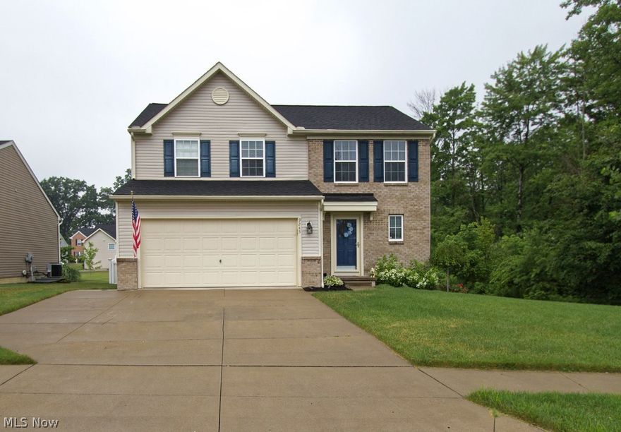 Beautiful 3 bedroom, 2.5 bath home in the sought after Highland Creek neighborhood! You will love the openness of the great room, kitchen, and sun room which serves as the perfect entertainment space. Check out the incredible kitchen with cherry wood cabinets with under cabinet lighting, stainless steel GE appliances, walk-in pantry, track lighting, and lovely hardwood floors that flow into the sun room with vaulted ceilings and an abundance of natural lighting. Conveniently situated between the kitchen and dinette space is a center island great for family dinners or serving guests. Amazing sun room with vaulted ceilings which overlooks the fenced-in backyard and offers sliding door access to the back deck. The master suite is super spacious with an 8x8 walk-in closet and a master bath with shower/tub combo. Bring your ideas for the lower level that is ready to be finished and plumbed for a bathroom. Other updates for this home include updated landscaping, professional paint, newly pai